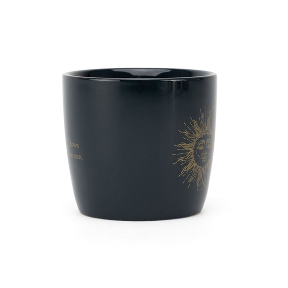 Keramisk mugg, sol och måne